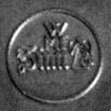 Značka slévárny na rubu závěsného medailonu - skutečný průměr 14 mm